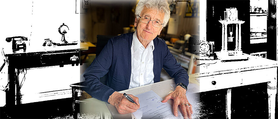 Erich H. Witte bei der Unterzeichnung des Schenkungsvertrags. Im Hintergrund ein Blick in das ehemalige Labor William Sterns.